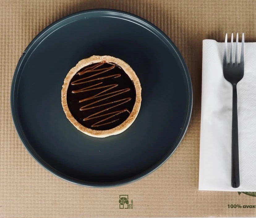 A chocolate tart with a fork.