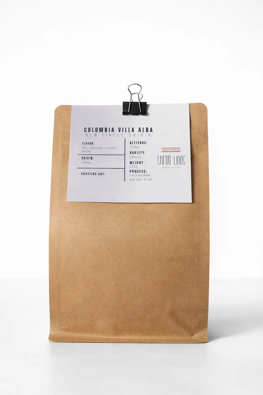 Kraft paper coffee bag with a label on a white background