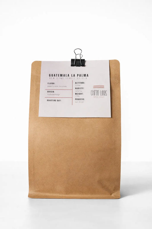 Kraft paper coffee bag with a label on a white background